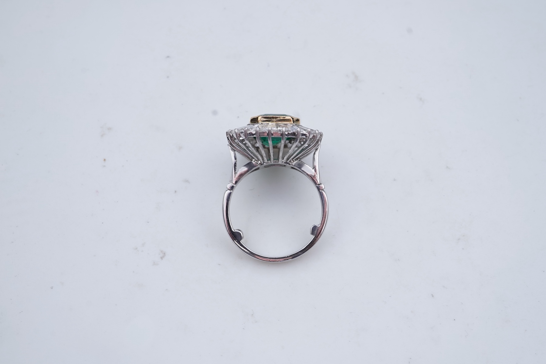 An emerald and diamond ring